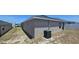 Exterior of home showing siding, an HVAC unit, and dry grass in backyard at 1540 Fleur Dr, Davenport, FL 33837
