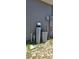 Utility equipment near home's exterior, including water filtration system and electrical components at 1540 Fleur Dr, Davenport, FL 33837