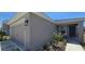 The charming exterior of a single-Gathering home shows a well manicured lawn and an attached two-car garage at 1540 Fleur Dr, Davenport, FL 33837