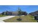 Beautiful exterior view of a single Gathering home with a well manicured lawn and two-car garage at 1540 Fleur Dr, Davenport, FL 33837