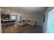Open-concept living room flowing into the kitchen with a breakfast bar, great for entertaining at 1540 Fleur Dr, Davenport, FL 33837