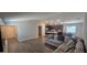 Open concept living room and kitchen provide ample natural light, spacious areas, and modern flooring at 1540 Fleur Dr, Davenport, FL 33837