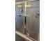 Modern bathroom shower enclosed in glass, showing neutral tile and chrome hardware at 1540 Fleur Dr, Davenport, FL 33837