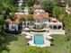 A beautiful aerial view of the home showcasing the pool, patio, and lush greenery surrounding the property at 1640 E Adams Dr, Maitland, FL 32751