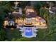 An aerial twilight view of the sprawling estate, highlighting the pool area, manicured grounds, and grand architecture at 1640 E Adams Dr, Maitland, FL 32751