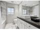 Modern bathroom featuring a large vanity, walk-in shower, and elegant fixtures, creating a spa-like experience at 1640 E Adams Dr, Maitland, FL 32751