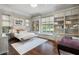 Bedroom featuring custom built-ins, hardwood floors, and great natural light at 1640 E Adams Dr, Maitland, FL 32751