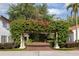 Beautiful courtyard entrance with brick pavers and lush greenery, offering a serene welcome at 1640 E Adams Dr, Maitland, FL 32751