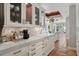 Bright kitchen features marble countertops, custom cabinetry, and stainless steel appliances, plus great natural light at 1640 E Adams Dr, Maitland, FL 32751