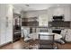 Bright kitchen with white cabinets, stainless steel appliances, a center island, and a cozy breakfast nook at 1640 E Adams Dr, Maitland, FL 32751