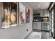 Stylish kitchenette area with modern gray cabinets, stainless steel appliances, and unique movie poster decor at 1640 E Adams Dr, Maitland, FL 32751