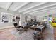 Bright living room featuring neutral colors, beam ceilings, and a view into the dining area and kitchen at 1640 E Adams Dr, Maitland, FL 32751