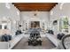 Bright and open living room featuring high ceilings, an elegant chandelier, and comfortable seating perfect for entertaining at 1640 E Adams Dr, Maitland, FL 32751
