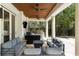 Outdoor patio with a fireplace, grill, wooden ceiling, and comfortable seating, perfect for entertaining at 1640 E Adams Dr, Maitland, FL 32751