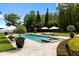 Beautiful swimming pool with spa, lounge chairs, and lush landscaping creating a serene and private oasis at 1640 E Adams Dr, Maitland, FL 32751