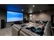 Luxurious theater room featuring a large screen, plush seating, and modern design elements at 1640 E Adams Dr, Maitland, FL 32751
