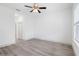 Bright and airy bedroom with laminate flooring, neutral walls, a ceiling fan, and a window at 16927 Sw 25Th Terrace Rd, Ocala, FL 34473