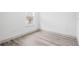 An empty bedroom features sleek floors and a window that lets in natural light at 16927 Sw 25Th Terrace Rd, Ocala, FL 34473
