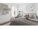 Nicely decorated bedroom features a desk, artwork, and a plush chair next to the bed at 16927 Sw 25Th Terrace Rd, Ocala, FL 34473