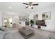 Living room with modern gray cabinets, kitchen island, contemporary decor, and a view to the backyard at 16927 Sw 25Th Terrace Rd, Ocala, FL 34473