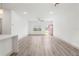Bright and airy living room featuring stylish flooring and a view of the front yard at 16927 Sw 25Th Terrace Rd, Ocala, FL 34473