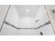 Close up on a tiled walk-in shower with decorative border and modern fixtures at 16927 Sw 25Th Terrace Rd, Ocala, FL 34473