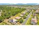 Aerial shot showcasing a beautiful neighborhood with mature trees, ponds, and well-maintained homes at 18108 Bellezza Dr, Orlando, FL 32820