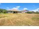 Expansive backyard featuring lush grass and beautiful landscaping, perfect for outdoor enjoyment at 18108 Bellezza Dr, Orlando, FL 32820