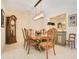Elegant dining room with a classic chandelier, grandfather clock, and beautiful furnishings at 18108 Bellezza Dr, Orlando, FL 32820