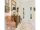 Tastefully decorated foyer with neutral colors, tiled floors, and classic furnishings at 18108 Bellezza Dr, Orlando, FL 32820