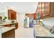 A kitchen view with granite countertops, stainless steel appliances, and dark wood cabinets at 18108 Bellezza Dr, Orlando, FL 32820