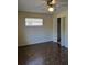 Bedroom with a ceiling fan, closet, and window at 1872 N Akron Dr, Deltona, FL 32738