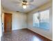 Well-lit bedroom with window views, vinyl flooring, ceiling fan and standard closet at 1872 N Akron Dr, Deltona, FL 32738