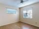 Bright bedroom with two windows and a ceiling fan, offering natural light at 1872 N Akron Dr, Deltona, FL 32738