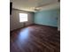 Bedroom featuring a ceiling fan, wood floors and a window bringing in natural light at 1872 N Akron Dr, Deltona, FL 32738