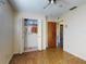 Bedroom features closet, door, and ceiling fan, providing functional living space at 1872 N Akron Dr, Deltona, FL 32738