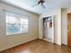 Bedroom featuring a ceiling fan, closet, and window, creating a comfortable space at 1872 N Akron Dr, Deltona, FL 32738