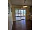 Bright dining area with wood floors and glass doors leading to an outdoor patio at 1872 N Akron Dr, Deltona, FL 32738