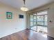 Dining room with wood-look floors and a sliding glass door leading to a screened-in lanai at 1872 N Akron Dr, Deltona, FL 32738