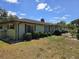 Side view of a one-story home with verdant landscaping, showcasing its well-maintained exterior and clean design at 1872 N Akron Dr, Deltona, FL 32738