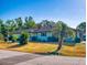 Charming single-story home with a well-maintained lawn, mature landscaping, and a classic exterior at 1872 N Akron Dr, Deltona, FL 32738