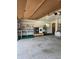 View of a spacious garage with a washer, dryer, shelving, and a door to the house at 1872 N Akron Dr, Deltona, FL 32738