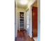 Hallway leading to rooms with built-in linen shelving at 1872 N Akron Dr, Deltona, FL 32738