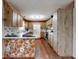 Bright kitchen with wooden cabinets, modern appliances, and cozy breakfast bar area at 1872 N Akron Dr, Deltona, FL 32738