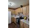 Cozy kitchen features wood cabinets, modern appliances, and plenty of counter space at 1872 N Akron Dr, Deltona, FL 32738