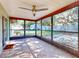 The tiled floor of the screened-in lanai, with a ceiling fan, enhances outdoor comfort at 1872 N Akron Dr, Deltona, FL 32738