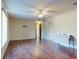 Bright living room with ceiling fan, wood flooring and neutral walls at 1872 N Akron Dr, Deltona, FL 32738