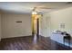 The living room features hardwood floors, neutral wall color, and a view of hallways leading to other rooms at 1872 N Akron Dr, Deltona, FL 32738