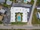 Aerial view showcases a community pool in a well-maintained building and ample parking at 1926 Ocean Shore Blvd # 3120, Ormond Beach, FL 32176