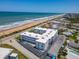 Aerial view of a beachfront condo featuring updated roofing, and proximity to the beach, and on-site parking at 1926 Ocean Shore Blvd # 3120, Ormond Beach, FL 32176